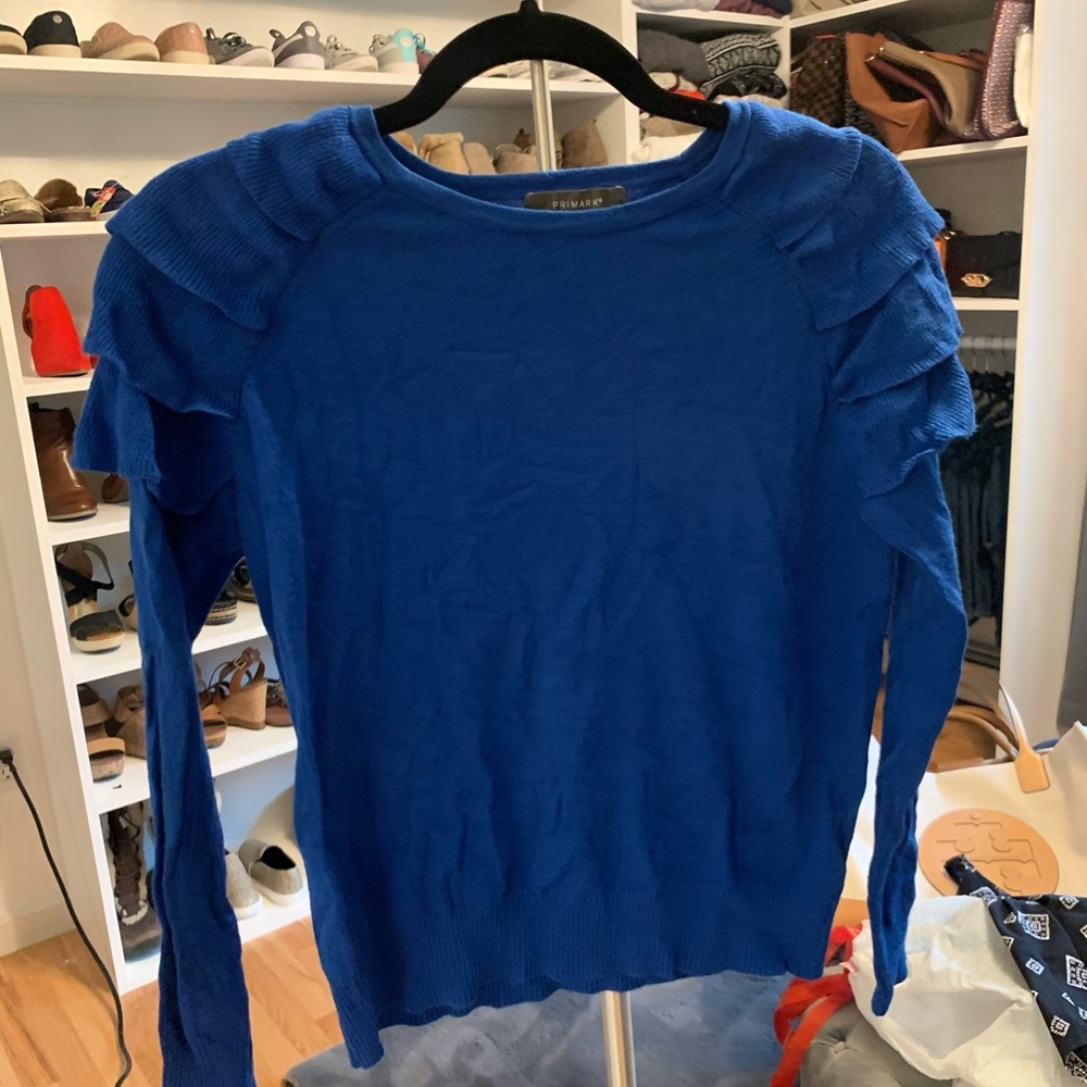Women’s blue Primark sweater.